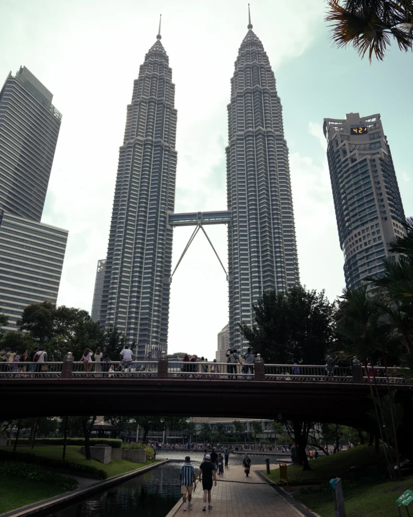 A wide shot of the Petronas Twin Towers at KLCC in Kuala Lumpur, Malaysia
