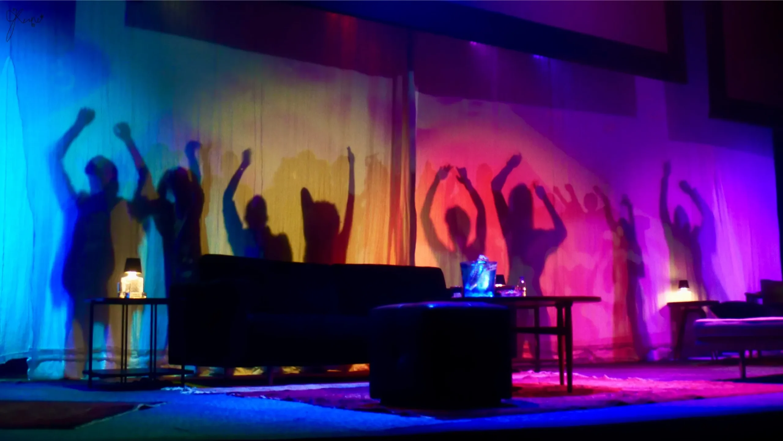 Scenes from Entourage (2025) showing silhouttes of dancers in a party